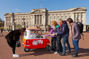 Ice cream man in smallest ice cream van in the world.