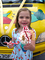 Little Casey enjoys a huge cup of ice cream served by ice cream man, Mister Nice Cream !