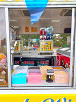Slush machines and ice cream toppings in the ice cream van.
