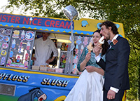 Groom and Bride cherish a moment with yumm ice cream outside the ice cream van of Mister Nice Cream.